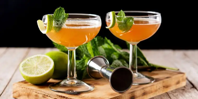 Old Cuban Cocktail with mint and lime garnish