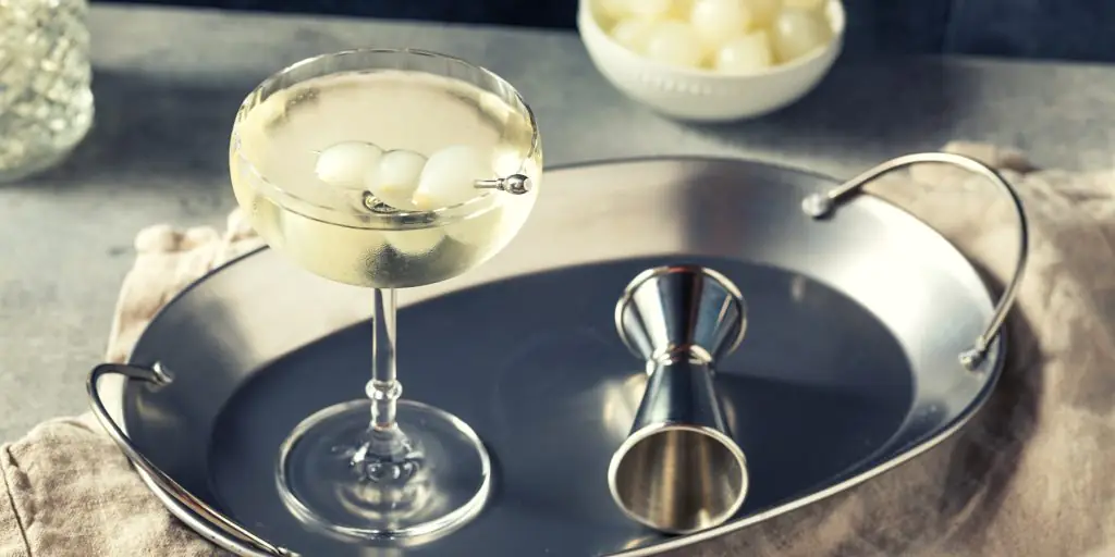 Dirty martini with pickled onion garnish