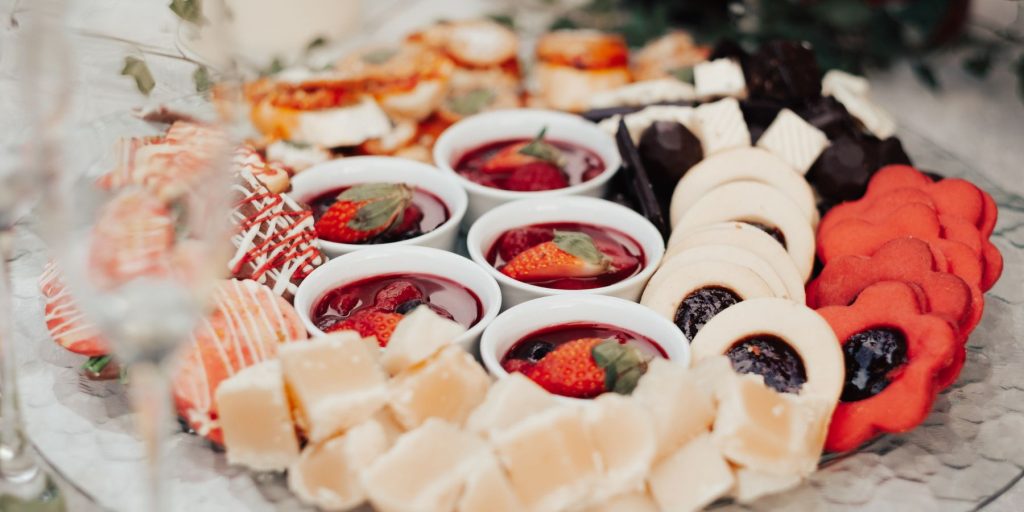 Close up of a dessert snack board featuring cookies, fudge, chocolate and other sweet treats