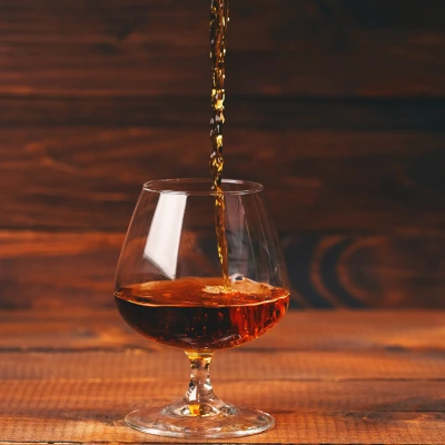Cognac pouring into a glass, by levgenil-Meyer