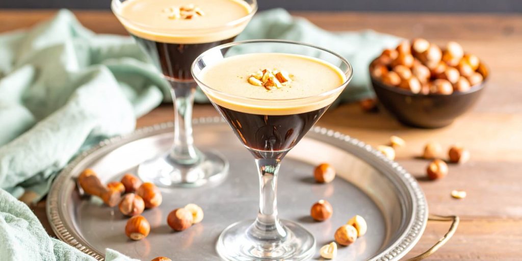 Close-up of two Hazelnut Espresso Martinis served on a silver tray