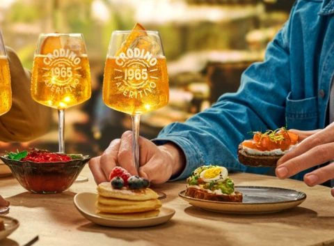 Three glasses of Crodino Non-Alcholic Spritz mocktails served during an aperitivo brunch