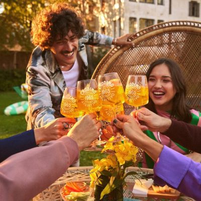 A group of friends enjoying aperitivo hour with non-alcholic Crodino